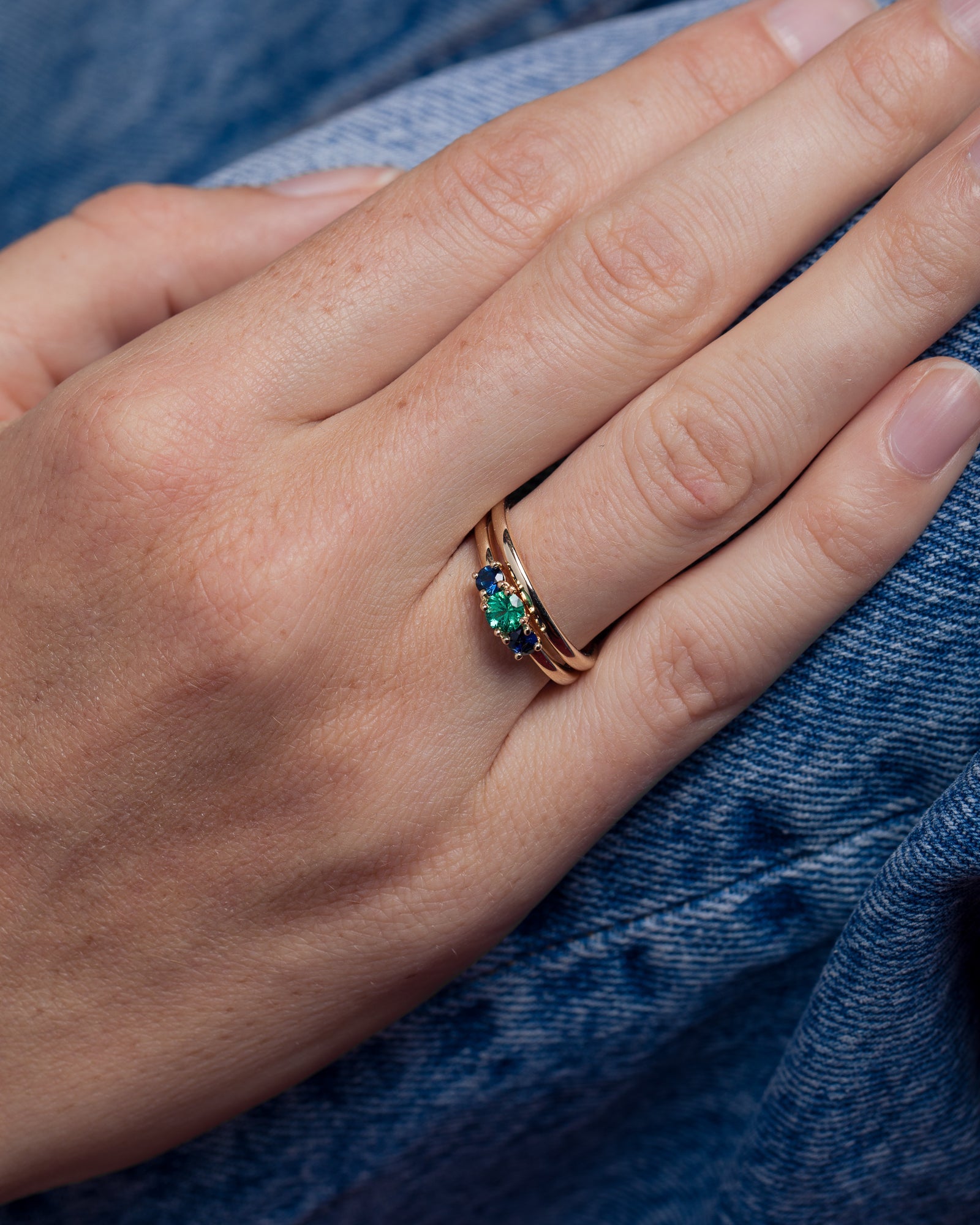 Trio Ring in Fairmined Gold with Montana Sapphires and Brazilian Emerald